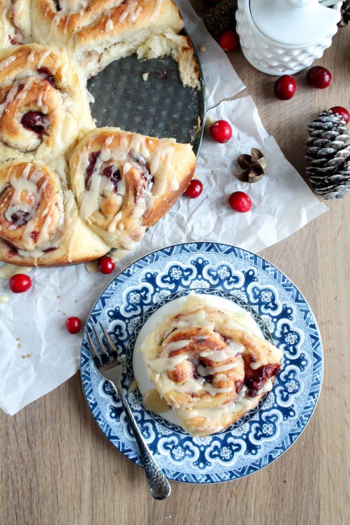 sweet rolls with leftover cranberry sauce filling - one roll on a plate with a fork ready to eat