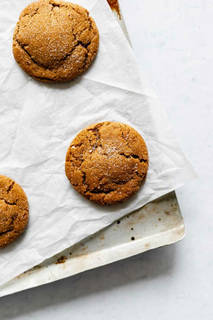Soft old-fashioned molasses ginger cookies on a baking sheet