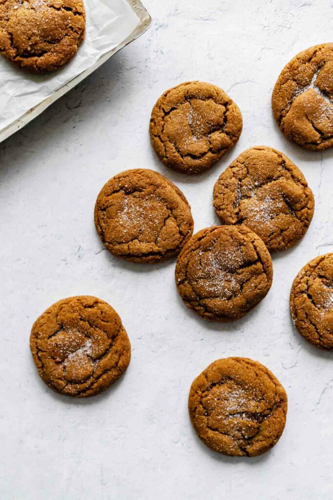 Soft old-fashioned molasses ginger cookies on a white surface