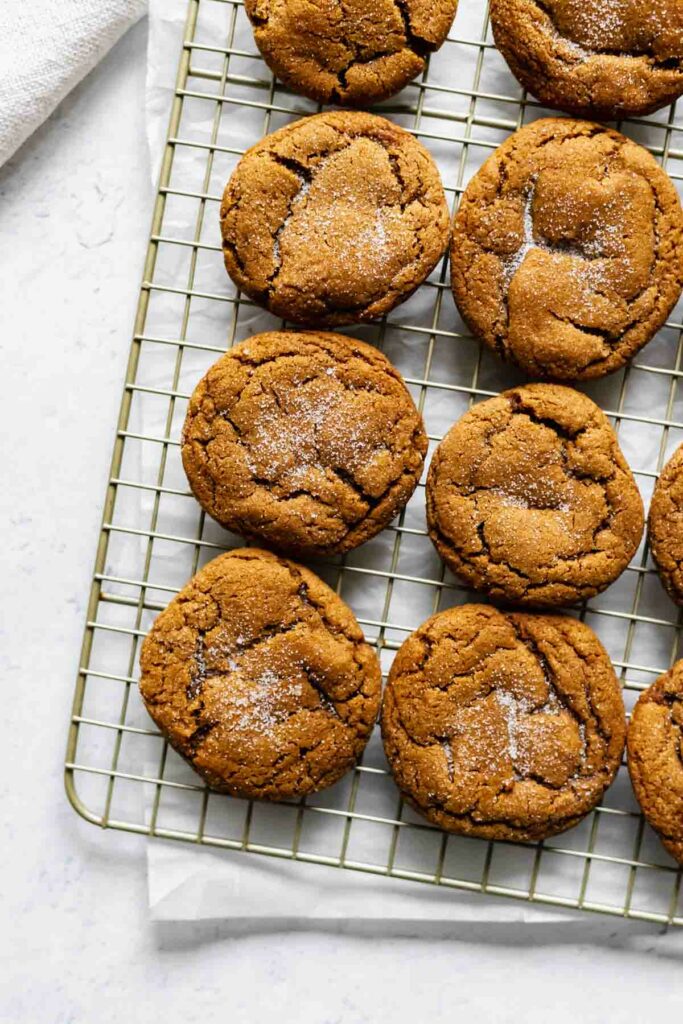 soft molasses crinkle cookies on a baking rack