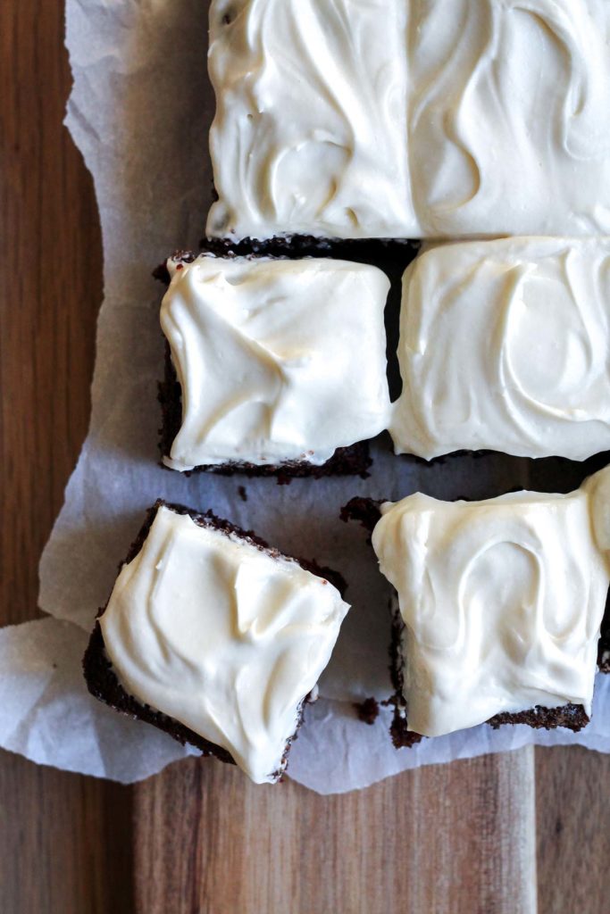 Overhead view of square slices of Guinness cake on a cutting board 