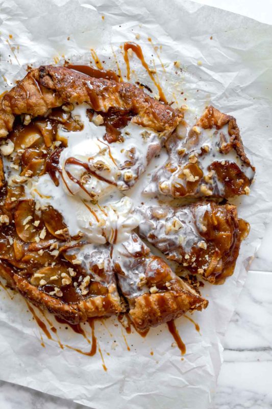 Slices of Salted Caramel Apple Galette with vanilla ice cream over top