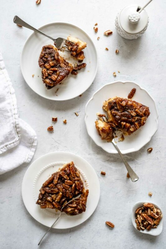 Three easy sticky buns on a table with forks