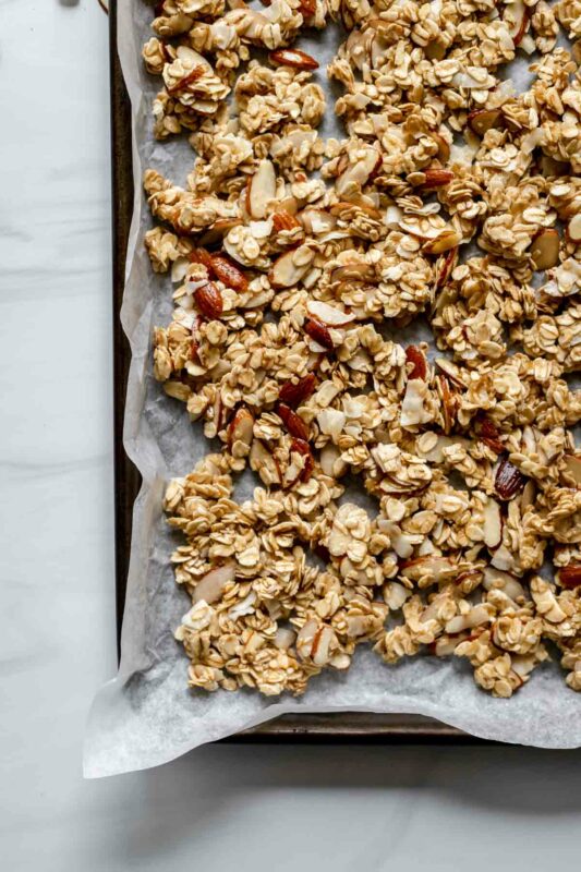 Unbaked granola on a cookie sheet