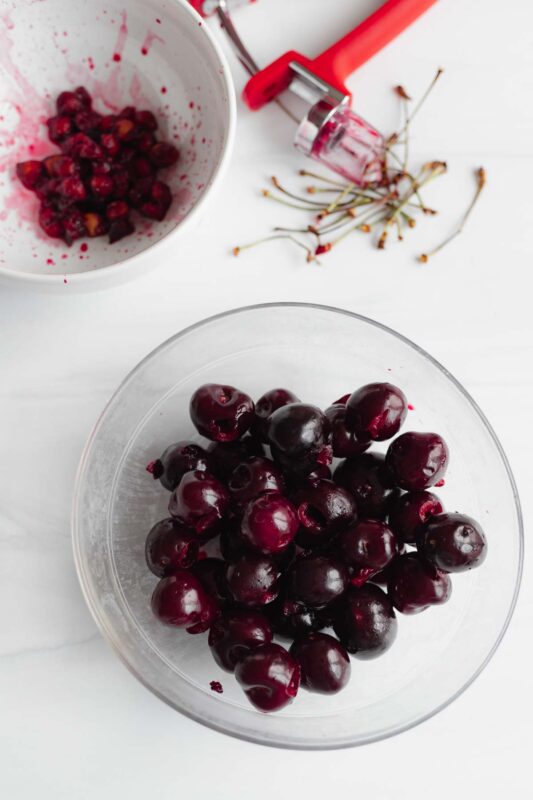 A bowl of pitted and sliced cherries