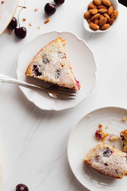 Slices of cherry almond cake made with fresh cherries and almond extract