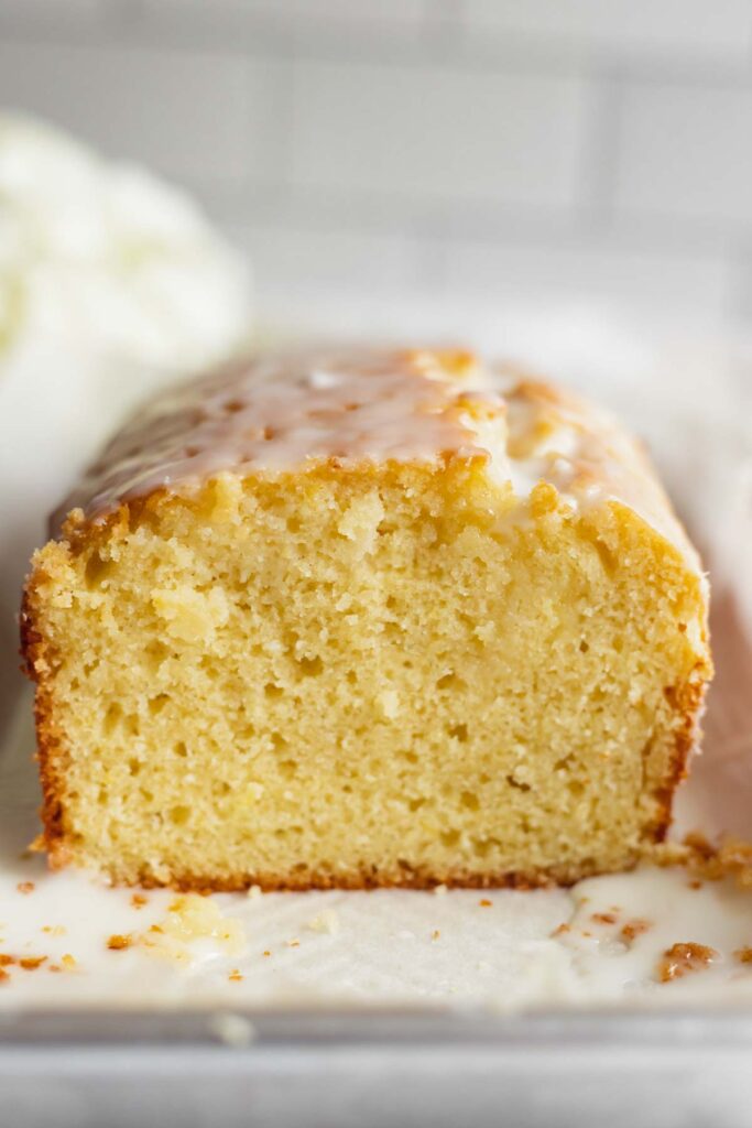 Close up shot of the interior of an iced lemon loaf