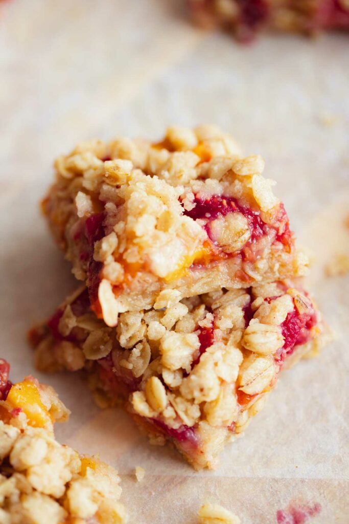 close up photo of the finished peach raspberry crumble bars