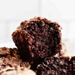 small batch double chocolate banana muffins - close up shot of a muffin with a bite taken out