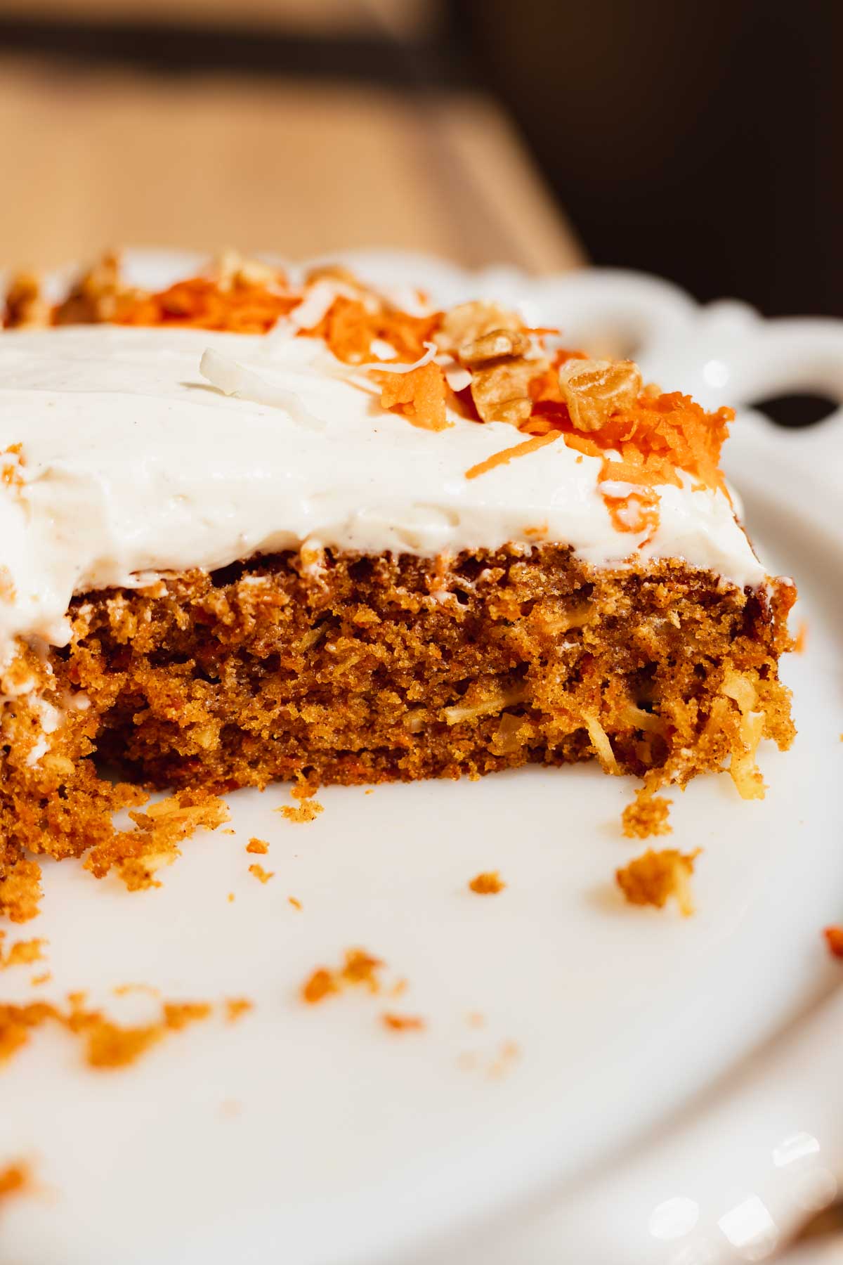 cross section slice of single layer carrot cake on a white plate